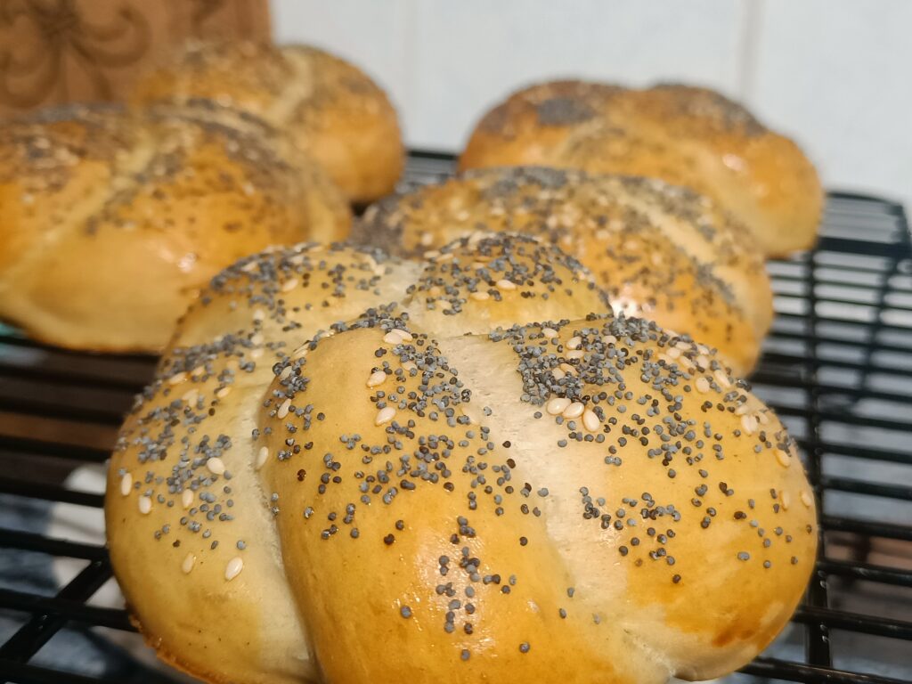 Freshly baked Kaiser rolls topped with poppy and sesame seeds